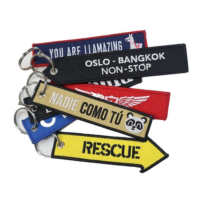 "Rescue and motivational slogan woven keychains in bold colors"