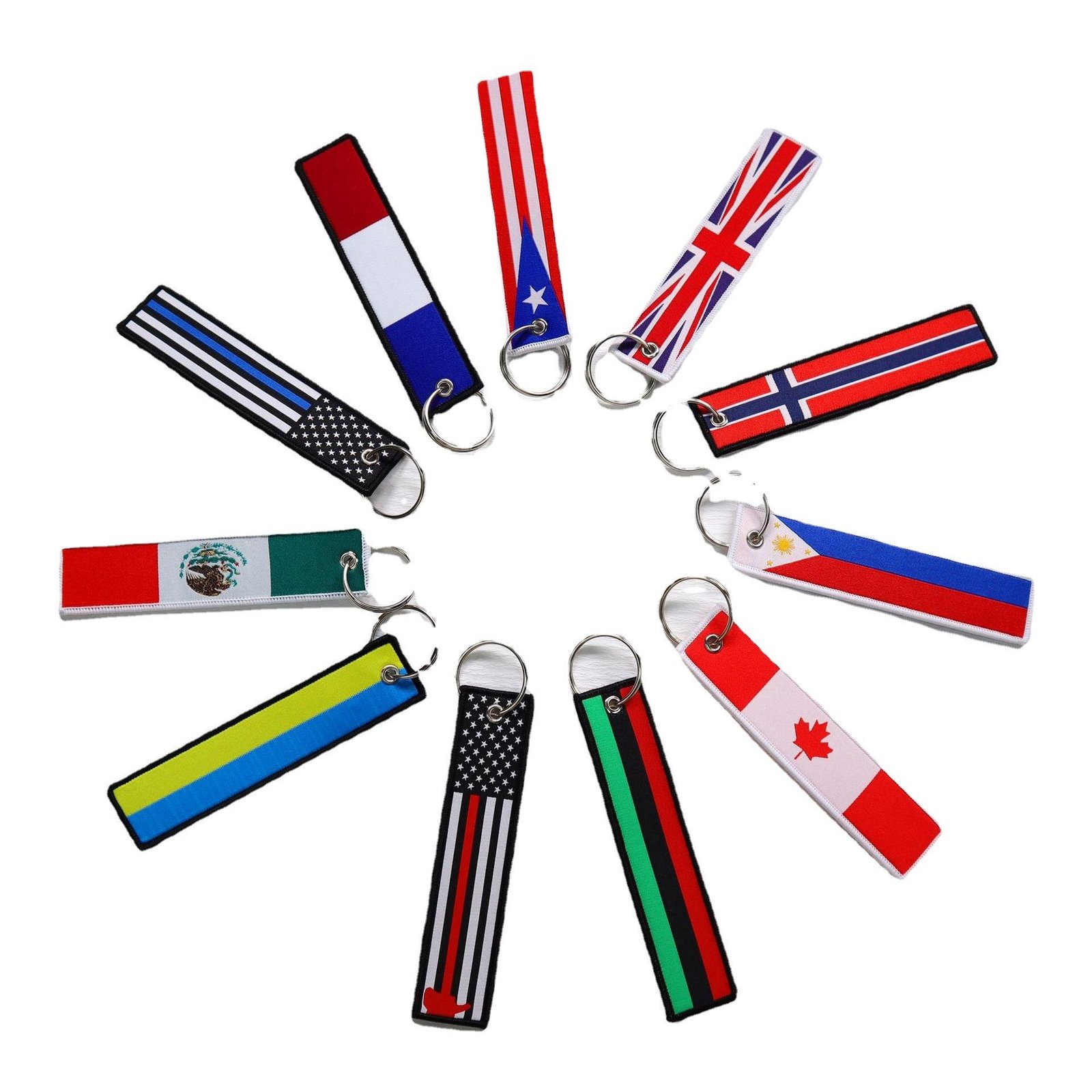 "Assorted country flag woven keychains displayed in a circular arrangement"