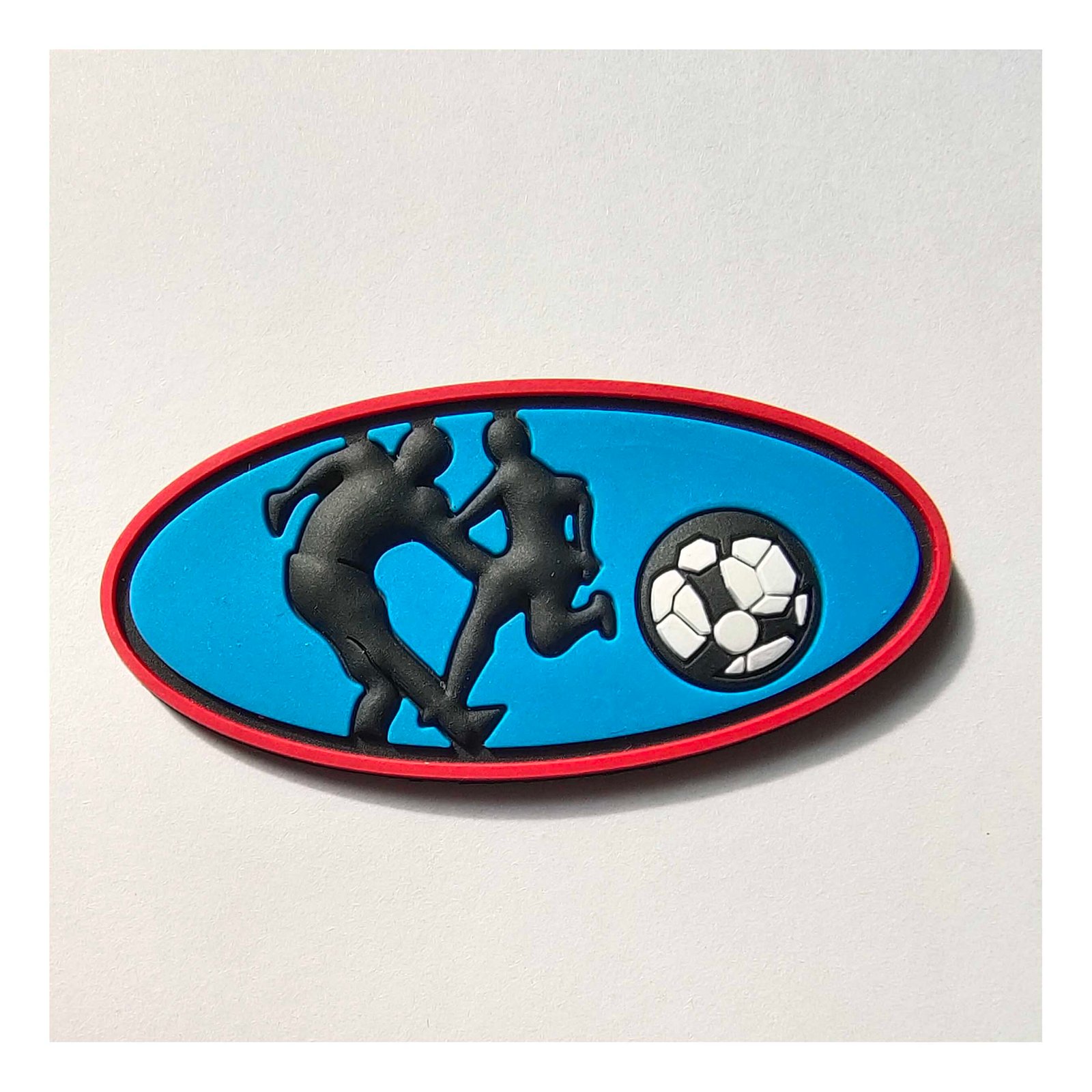 Soccer-themed PVC patch in oval shape with detailed design