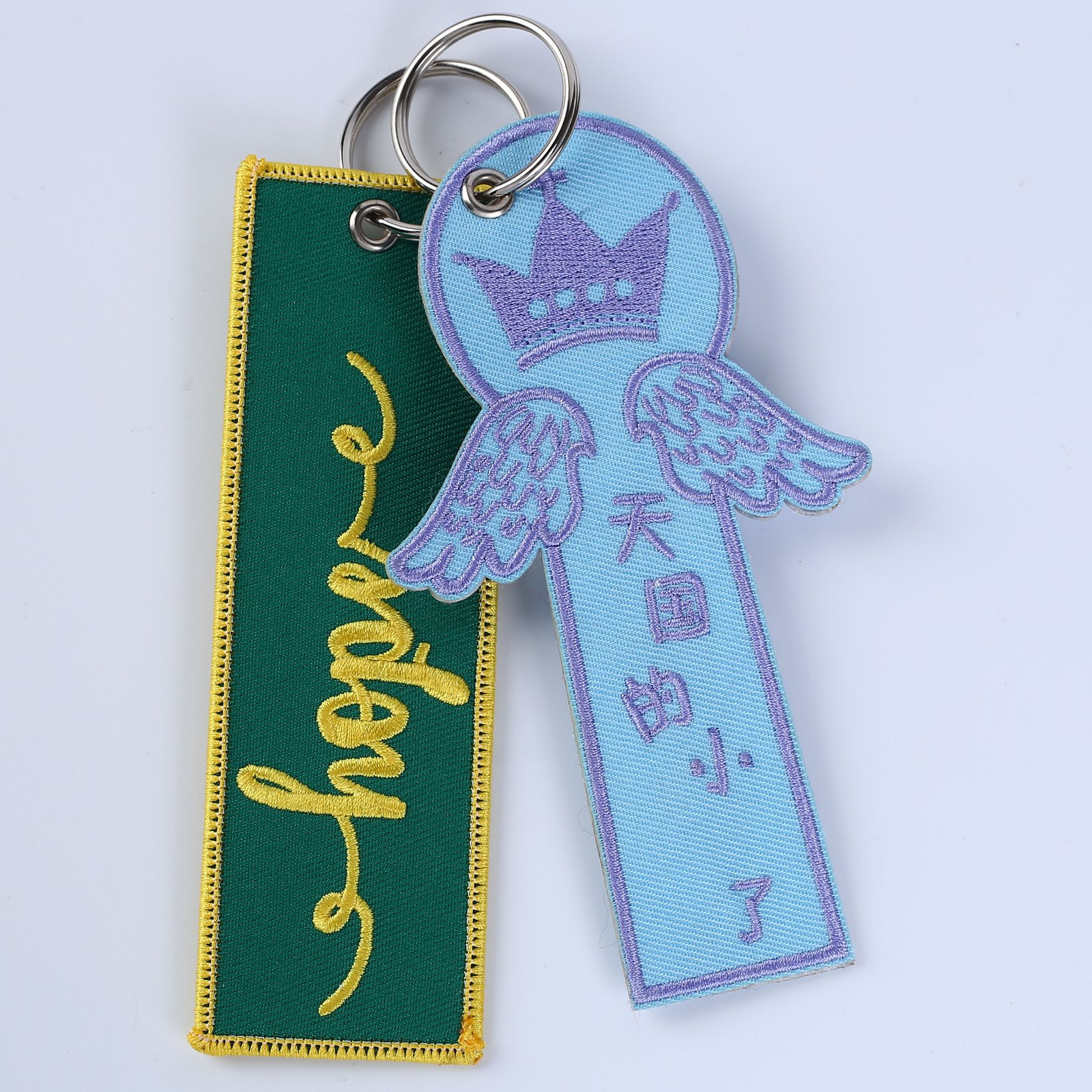 "Custom embroidered keychains featuring 'Lift With Aloha' and 'AIRMED' branding."