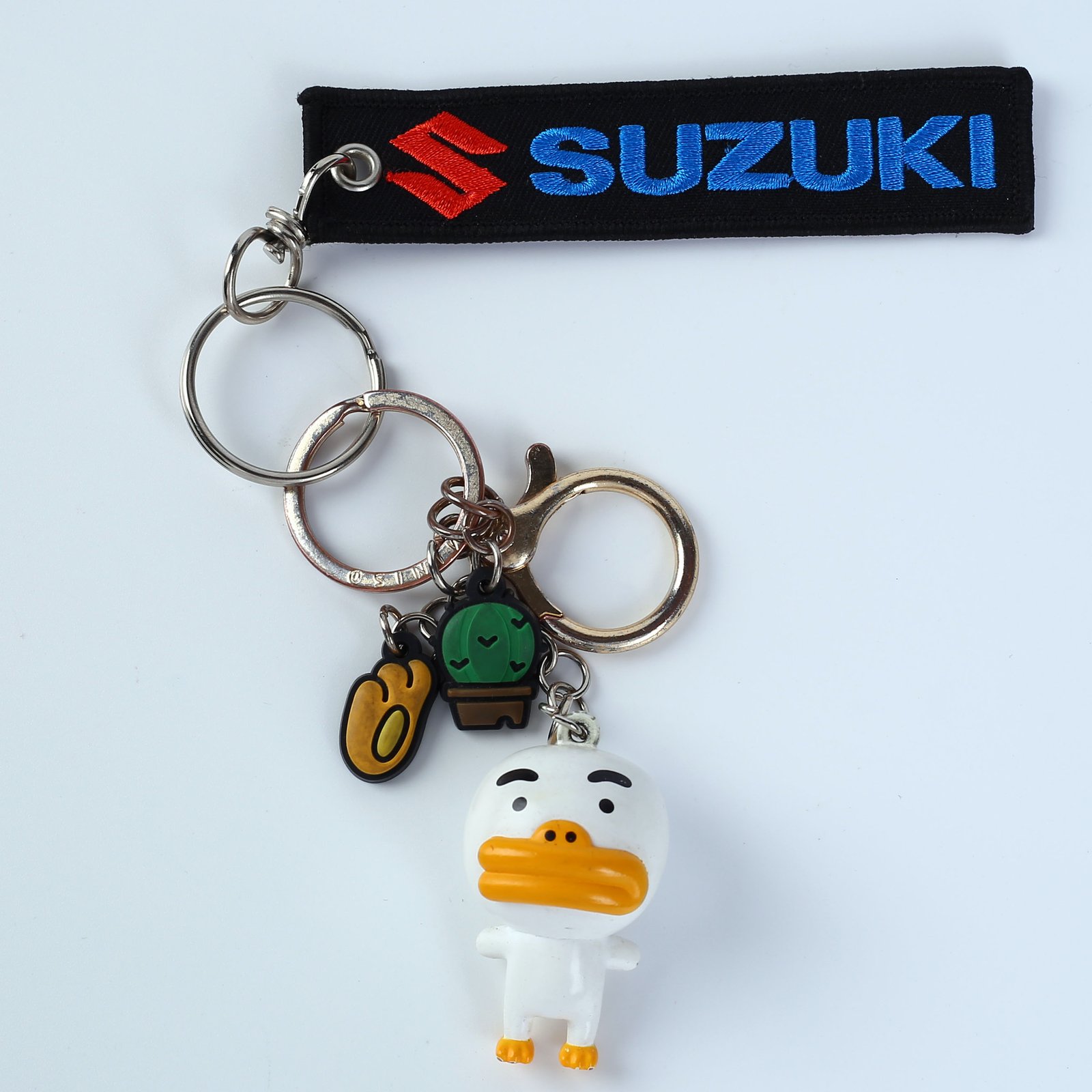 "Embroidered keychains with diverse branding such as 'Swobbee', 'KS Tools', and 'Remove Before Flight'."