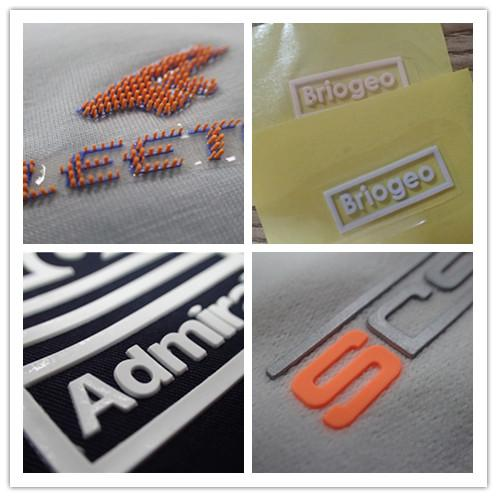 "Screen Printing Labels and Heat Transfer Labels Samples Featuring Orange Dot Design, Transparent Logo, Durable White Print, and Raised 3D Elements for Modern Apparel Branding."