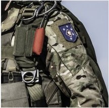 "Military Uniform with Tactical Flag Patch Displayed"